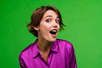 Portrait of astonished cheerful person open mouth cant believe news isolated on green color background - obrazy, fototapety, plakaty