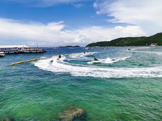 Naklejka premium beautiful landscape view of Koh Larn island focus on wave from jet ski in the sea, Chonburi, Thailand