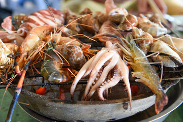Shrimps and squids grilled on stove