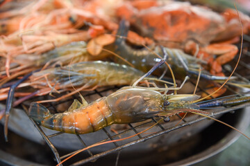 shrimps and crabs grilled on stove