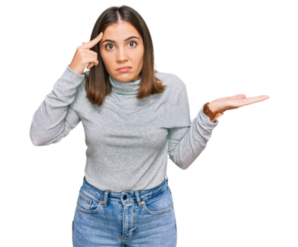 Young beautiful woman wearing casual turtleneck sweater confused and annoyed with open palm showing copy space and pointing finger to forehead. think about it.