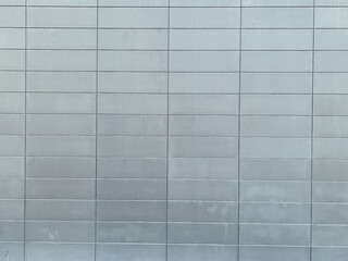 gray metal wall with cells as background