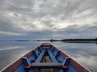 Traditional boat and morning sky at Thale Noi, The large lake in Phatthalung, Southern of Thailand.