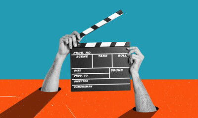 Hands holding clapper board making video cinema in studio. Movie production clapper board. - obrazy, fototapety, plakaty