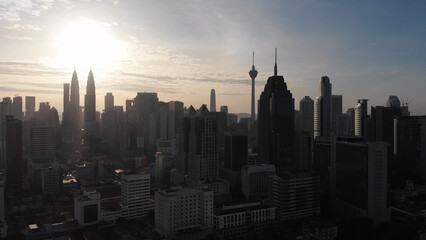 Aerial view of the silhouette of skyscrapers and the city center of Kuala Lumpur.