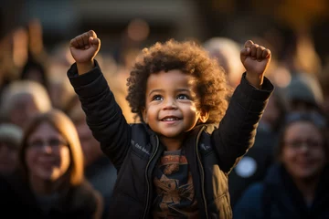 Fotobehang Little black boy with raised fist. Black history month © kazakova0684