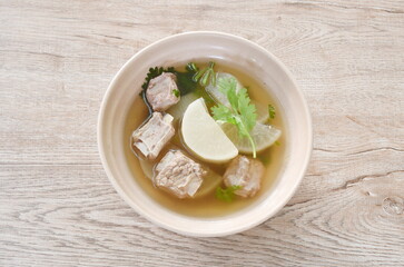 boiled slice radish with chop pork bone soup on bowl 