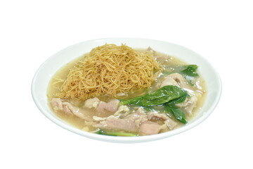 fried vermicelli noodle in black soy sauce with slice soft marinated pork and Chinese kale dressing gravy sauce on plate 