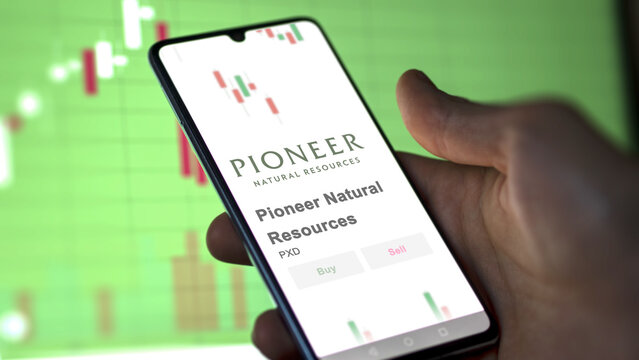 November 27st 2023 Irving, Texas. The logo of Pioneer Natural Resources on the screen of an exchange. Pioneer Natural Resources price stocks, $PXD on a device.