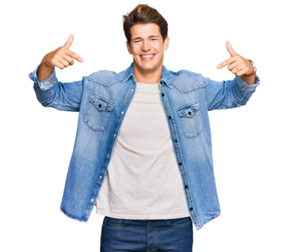 Handsome caucasian man wearing casual denim jacket looking confident with smile on face, pointing oneself with fingers proud and happy.