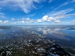 Clouds over sea at ebb time