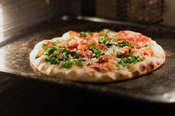Cook pizza at home Owen. Shallow focus