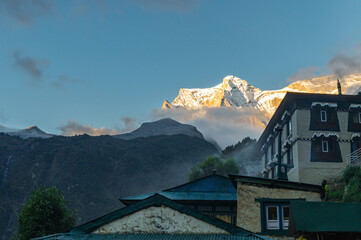 View of Kongde mountain and lodge at sunrise from Namche Bazar in the Khumbu region of Nepal, Asia. EBC or Three passes trekking in Himalayas.