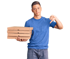 Young handsome hispanic man holding delivery pizza box with angry face, negative sign showing dislike with thumbs down, rejection concept