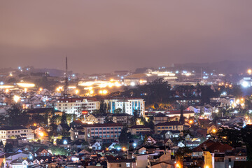 View on roofs in the city of Dalat. Da Lat and the surrounding area is a popular tourist destination of Asia. City with fogs and mountains