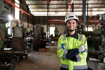 Engineer Women looking in front of camera with holding tool and giving a proud smiling on her face