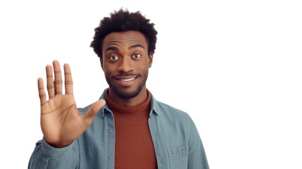 Fototapeta premium Young black man greeting camera during a video call by waving and saying hello.