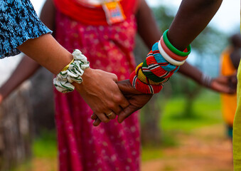 Western tourits dancing with samburu women, Samburu County, Samburu National Reserve, Kenya
