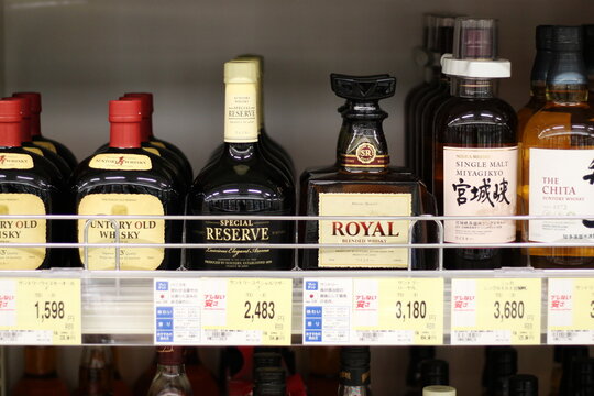 CHIBA, JAPAN - May 10th, 2018: Various types of the Japanese whiskey, including three types produced by Suntory, on a supermarket shelf.