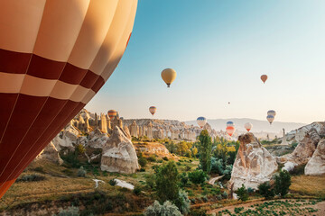 Beautiful morning scene with Hot air balloons flying over Cappadocia at sunrise, Turkey