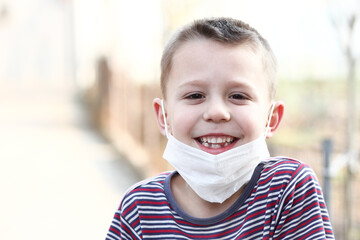 masked child from coronavirus and air. Protection against PM 2.5 air polluted from the virus in...
