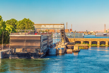 Fototapeta premium Cruise ships pass through the Esna lock.