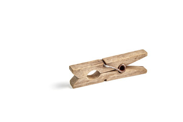 Old rusty wooden clothespin for drying clothes isolated on white background