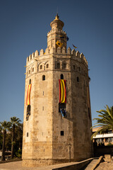 Fototapeta na wymiar Torre del Oro dodecagonal military watchtower in Seville, southern Spain. Installed by Almohad Caliphate to control access to from Guadalquivir river defensive tower structure historic landmark