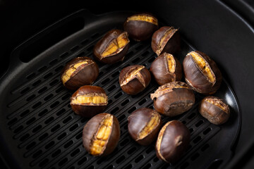 Close-up photo of delicious chestnuts | castanea sativa roasted in an air fryer.