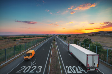 2024 Happy New Year.Driving on open road at beautiful sunset. Aerial view - obrazy, fototapety, plakaty