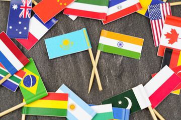 The concept is diplomacy. In the middle among the various flags are two flags - India, Kazakhstan