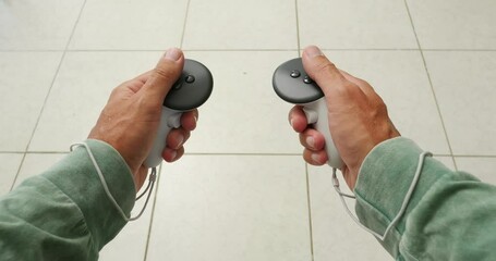 POV of hands holding white controllers, plays in virtual reality.