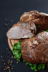 Baked meat in large chunks. A dish of Russian cuisine. Baked meat. A delicious meat dish.