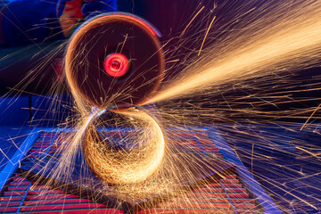 pipe cutting by angle grinder with sparks