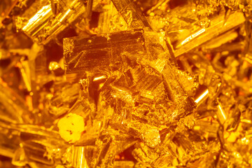 Golden crystal mineral stone. Gems. Mineral crystals in the natural environment. Texture of...