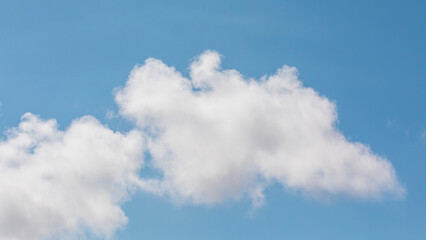 Naklejka na ściany i meble Panoramic background of white clouds with blue sky