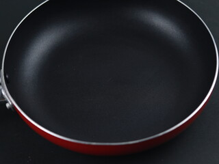frying pan isolated on black background