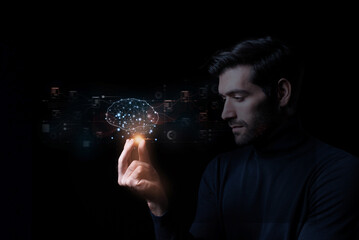 Close-up of a man's hand with a circuit hologram and a glowing cloud brain against a dark...
