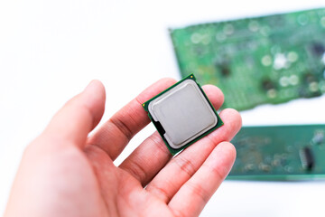 IC CPU in hand with PCB board background. Concept of Technology computer and hardware computer.