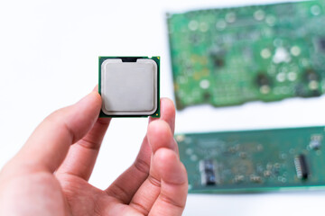 IC CPU in hand with PCB board background. Concept of Technology computer and hardware computer.