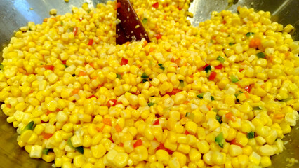 fresh corn in the skillet being cooked