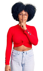 Young african american girl wearing casual clothes and glasses asking to be quiet with finger on lips. silence and secret concept.