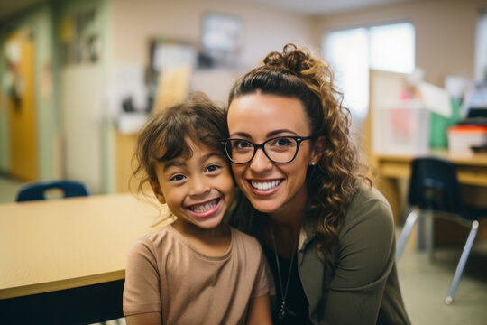 Cute Hispanic Language Therapist Working With A Kid In A Special Needs School.