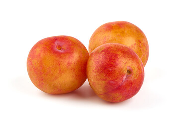 Sweet yellow plums, isolated on white background.