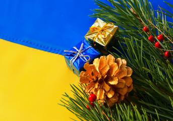 Ukrainian flag, Christmas tree branches and New Year decorations.
