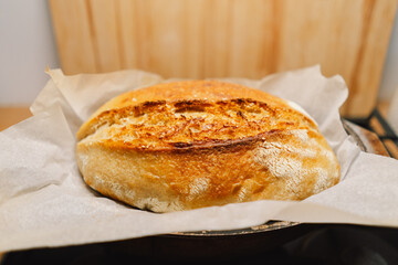Fresh baked bread at home. Loaf of sourdough craft bread. Delicious homemade sourdough bread