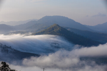 High-angle natural background from a vantage point, overlooking the sun's rays blurred in the morning in the middle of the sea, is a beautiful glowing golden light of nature that can't be seen much.