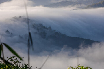 High-angle natural background from a vantage point, overlooking the sun's rays blurred in the morning in the middle of the sea, is a beautiful glowing golden light of nature that can't be seen much.