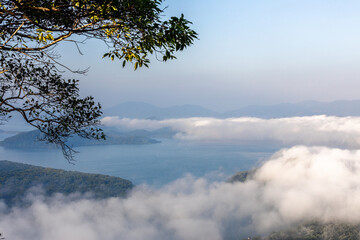 High-angle natural background from a vantage point, overlooking the sun's rays blurred in the morning in the middle of the sea, is a beautiful glowing golden light of nature that can't be seen much.