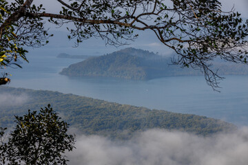 High-angle natural background from a vantage point, overlooking the sun's rays blurred in the morning in the middle of the sea, is a beautiful glowing golden light of nature that can't be seen much.